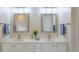 Double vanity bathroom with two sinks, mirrors, and a large linen closet at 1506 Lavista Proper Cir, Decatur, GA 30033
