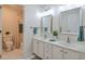 Bathroom with double vanity, large mirror, and shower/tub combo at 1506 Lavista Proper Cir, Decatur, GA 30033