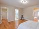 Spacious bedroom with wood floors, walk-in closet, and ensuite bathroom at 1506 Lavista Proper Cir, Decatur, GA 30033