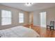 Bedroom with hardwood floors, two windows, and access to bathroom at 1506 Lavista Proper Cir, Decatur, GA 30033
