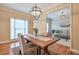 Bright dining room with hardwood floors and chandelier at 1506 Lavista Proper Cir, Decatur, GA 30033
