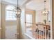 Bright entryway with overhead lighting and view to dining room at 1506 Lavista Proper Cir, Decatur, GA 30033
