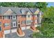 Brick townhouses with attached garages and landscaping at 1506 Lavista Proper Cir, Decatur, GA 30033