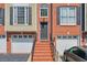 Brick townhouse with attached garage and front steps at 1506 Lavista Proper Cir, Decatur, GA 30033