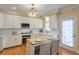 Modern kitchen with white cabinets, stainless steel appliances, and an island at 1506 Lavista Proper Cir, Decatur, GA 30033