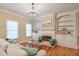 Living room boasts hardwood floors, built-in shelving, and a fireplace at 1506 Lavista Proper Cir, Decatur, GA 30033