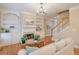 Living room features hardwood floors, built-in shelving, and a fireplace at 1506 Lavista Proper Cir, Decatur, GA 30033