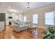 Living room with hardwood floors, open to kitchen, and neutral decor at 1506 Lavista Proper Cir, Decatur, GA 30033