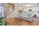 Open living room with hardwood floors, a comfortable sofa, and kitchen views at 1506 Lavista Proper Cir, Decatur, GA 30033