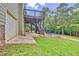 Deck, stairs, garage, and view of large backyard at 8322 Saucier Dr, Douglasville, GA 30135