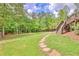 Stone pathway to deck and stairs leading to backyard at 8322 Saucier Dr, Douglasville, GA 30135