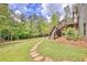 Stone pathway to deck and stairs leading to backyard at 8322 Saucier Dr, Douglasville, GA 30135