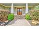 Charming front porch with stone details and white columns at 8322 Saucier Dr, Douglasville, GA 30135