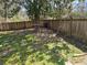 Fenced backyard with mature tree, and green space perfect for enjoying the outdoors at 1551 Ferno Nw Dr, Atlanta, GA 30318