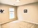 Bright bedroom with neutral walls and carpet flooring at 1710 Aurelia Dr, Cumming, GA 30041