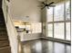 Two-story Gathering room with kitchen views and hardwood floors at 1710 Aurelia Dr, Cumming, GA 30041