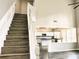 View of staircase and kitchen from the entryway at 1710 Aurelia Dr, Cumming, GA 30041