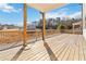 Spacious wooden backyard deck with railing, supported by sturdy posts with neighborhood view at 2131 Landsburg Way, Lawrenceville, GA 30043