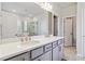 Bathroom featuring a double vanity and walk-in shower at 2131 Landsburg Way, Lawrenceville, GA 30043