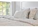 Close-up of neatly made bed with patterned bedding at 4266 Cabretta Se Dr, Smyrna, GA 30080