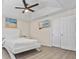 Spacious bedroom with queen bed, hardwood floors, ceiling fan, and double doors at 4266 Cabretta Se Dr, Smyrna, GA 30080