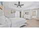Main bedroom with a king-size bed, hardwood floors, and ensuite bathroom at 4266 Cabretta Se Dr, Smyrna, GA 30080