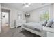 Well-lit bedroom with a bed, dresser and mounted TV at 4266 Cabretta Se Dr, Smyrna, GA 30080