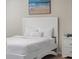 Bedroom with a white bed frame and beach-themed artwork at 4266 Cabretta Se Dr, Smyrna, GA 30080