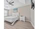 Bright bedroom with a queen-size bed, hardwood floors, and a ceiling fan at 4266 Cabretta Se Dr, Smyrna, GA 30080