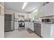 Kitchen boasts stainless steel appliances and white cabinets at 4266 Cabretta Se Dr, Smyrna, GA 30080