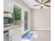 Kitchen with white cabinets, stainless steel appliances, and access to backyard at 4266 Cabretta Se Dr, Smyrna, GA 30080