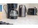 Close up of kitchen appliances including coffee maker and toaster at 4266 Cabretta Se Dr, Smyrna, GA 30080
