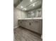 Bathroom features a double sink vanity, and walk-in shower at 1346 Lucan Ln # Wc227, Lawrenceville, GA 30043