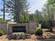 The Collections at Wolf Creek community sign with colorful landscaping in front at 1346 Lucan Ln # Wc227, Lawrenceville, GA 30043
