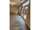 Bright living room with wood floors, ceiling fan, and access to the outdoor patio through glass doors at 1346 Lucan Ln # Wc227, Lawrenceville, GA 30043