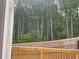 View of backyard with wooden fence and lush green trees at 1366 Lucan Ln # Wc225, Lawrenceville, GA 30043