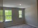 Bedroom with carpet, neutral walls and two windows allowing for natural light at 1366 Lucan Ln # Wc225, Lawrenceville, GA 30043