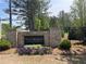 The Collections at Wolf Creek community sign is surrounded by seasonal flowers and landscaping at 1366 Lucan Ln # Wc225, Lawrenceville, GA 30043