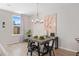 Dining area features a modern chandelier, artwork, and a window with natural light at 1366 Lucan Ln # Wc225, Lawrenceville, GA 30043