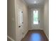 Light and bright entryway featuring hardwood floors and white trim at 1366 Lucan Ln # Wc225, Lawrenceville, GA 30043
