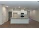 Modern kitchen with a large center island, stainless steel appliances, and ample lighting at 1366 Lucan Ln # Wc225, Lawrenceville, GA 30043