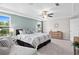 Stylishly furnished main bedroom with two large windows, ceiling fan and contemporary decor at 1366 Lucan Ln # Wc225, Lawrenceville, GA 30043