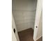 Walk-in pantry featuring wire shelving and wood flooring at 1366 Lucan Ln # Wc225, Lawrenceville, GA 30043