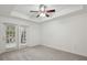 Bright bedroom with carpet flooring and access to a private balcony at 50 Biscayne Dr # 2109, Atlanta, GA 30309