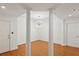 Dining room with hardwood floors, chandelier, and columns at 50 Biscayne Dr # 2109, Atlanta, GA 30309