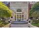 Building entrance with fountain and lush landscaping at 50 Biscayne Dr # 2109, Atlanta, GA 30309