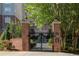 Brick building with gated entrance, landscaping, and a grand appearance at 50 Biscayne Dr # 2109, Atlanta, GA 30309