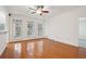 Bright living room with gleaming hardwood floors and a ceiling fan at 50 Biscayne Dr # 2109, Atlanta, GA 30309