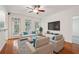 Living room with hardwood floors, furniture, and large TV at 50 Biscayne Dr # 2109, Atlanta, GA 30309