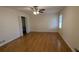 Hardwood floor bedroom with ceiling fan and closet at 3340 Berkshire Se Bnd, Conyers, GA 30013